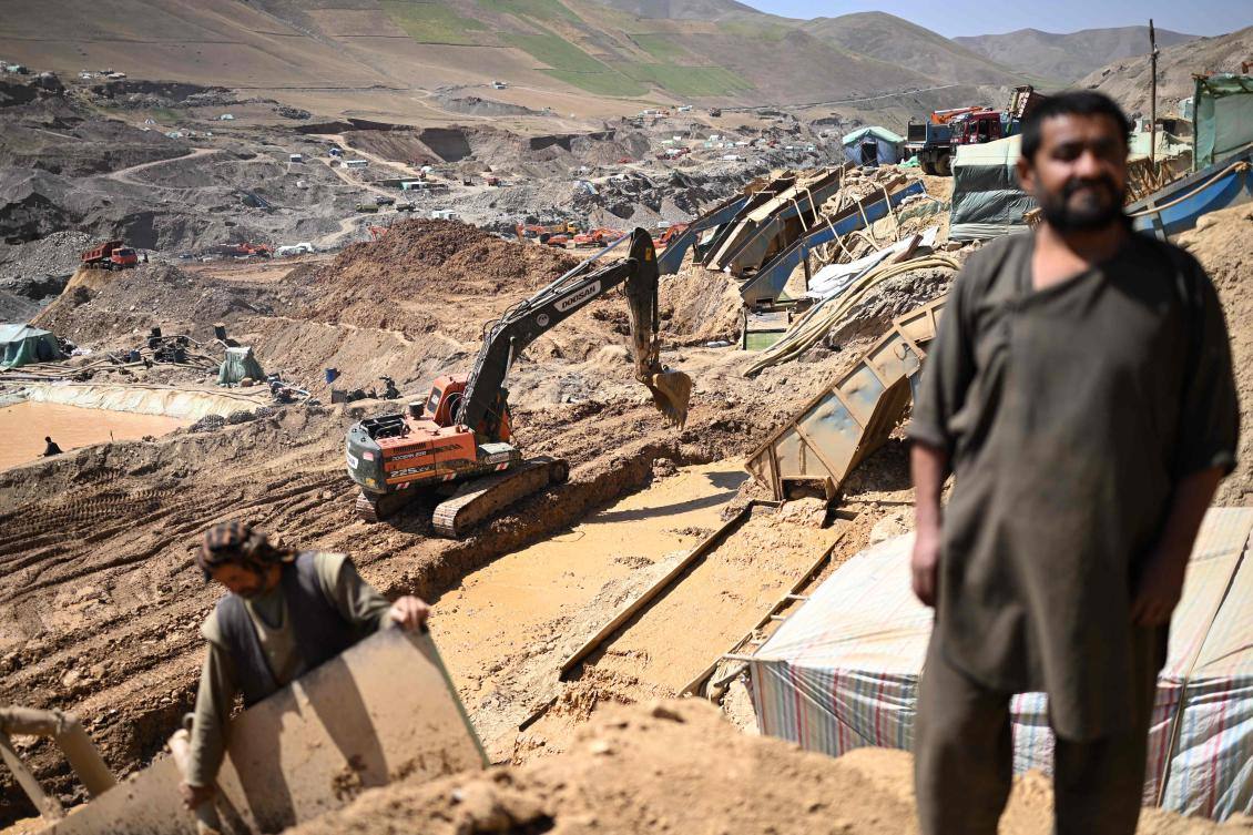 File photo of gold mining in Afghanistan, showing miners working a mountainside gold site