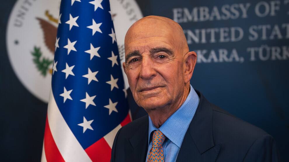 US Ambassador to Turkey Tom Barrack pictured in front of a US flag at the US Embassy in Ankara