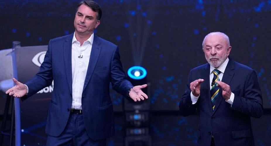 Senator Flavio Bolsonaro (left) and President Luiz Inacio Lula da Silva during their televised presidential debate in Sao Paulo on October 18, 2026