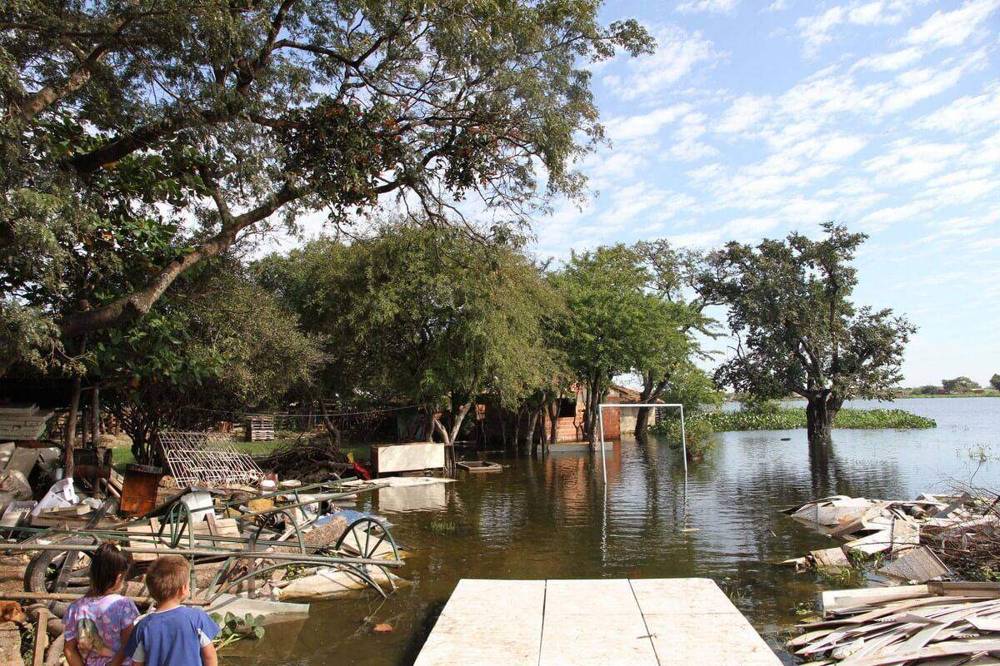 File photo of flooding in Paraguay, with homes surrounded by floodwater