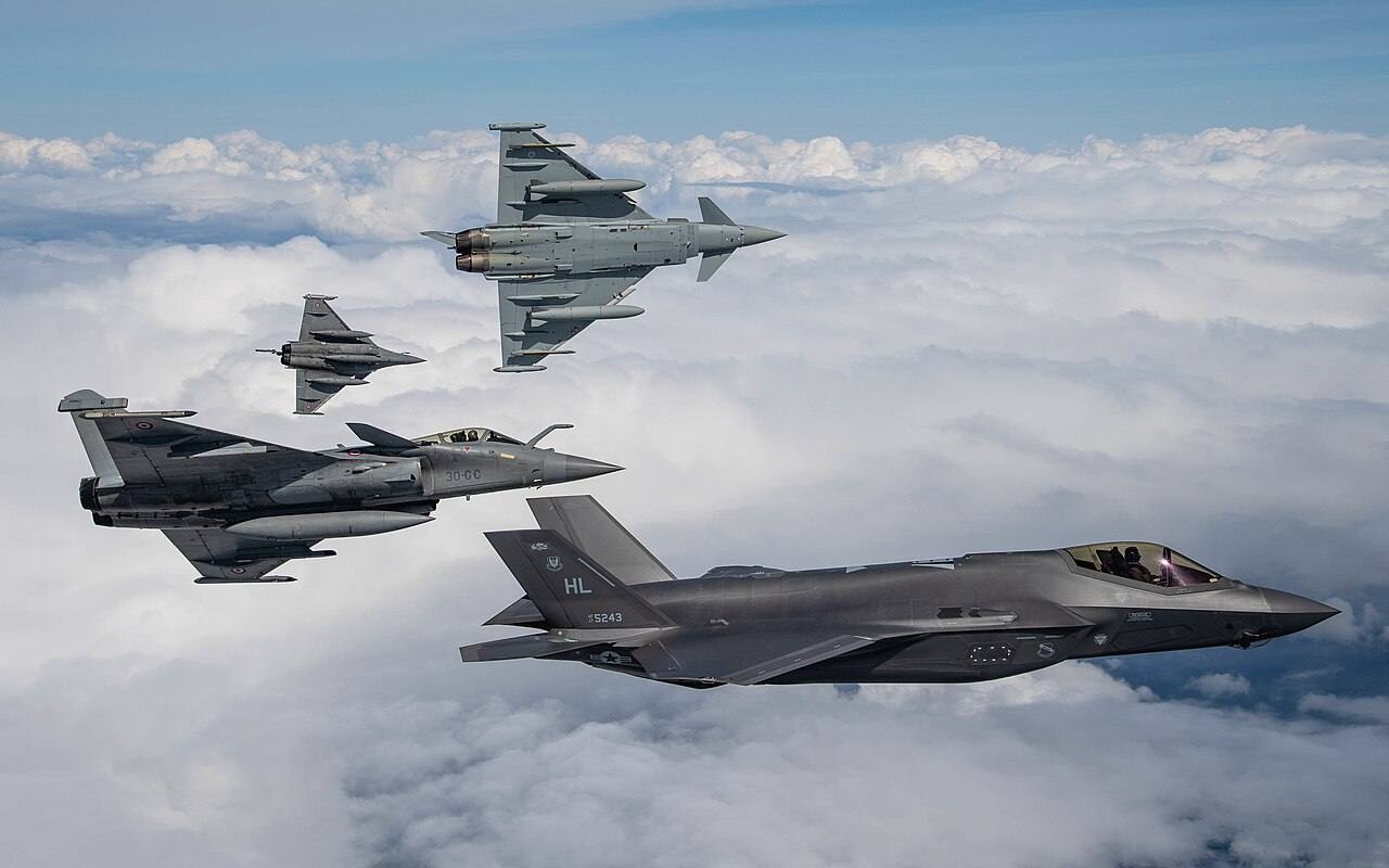 French Rafale jets and a Royal Air Force Eurofighter Typhoon in formation flight (file photo)