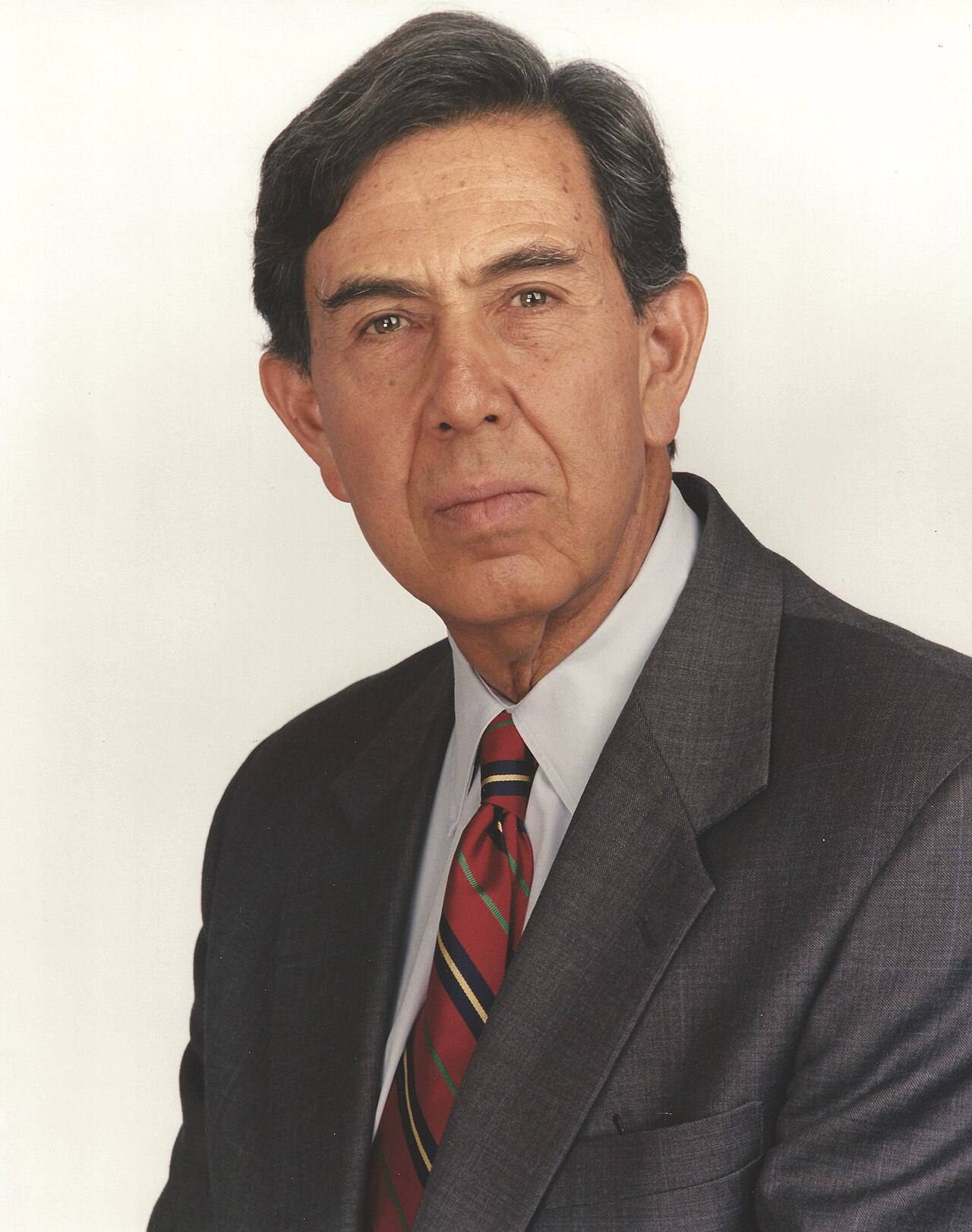 Portrait of Cuauhtemoc Cardenas, founder of Mexico's Party of the Democratic Revolution, in a suit and striped tie