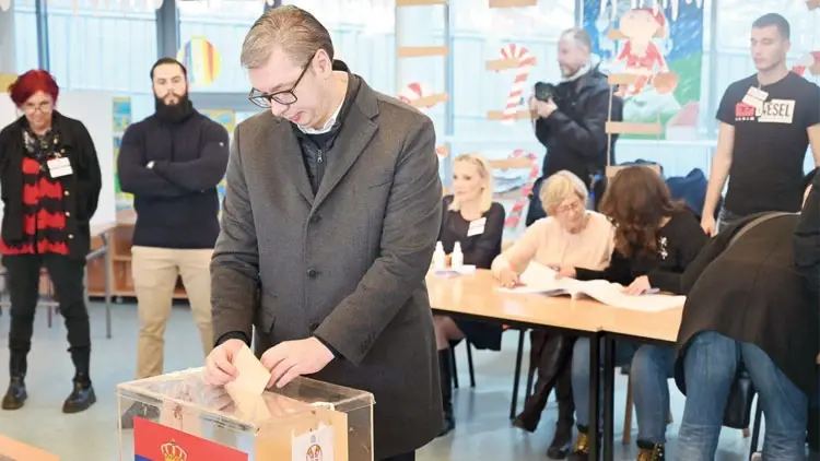 Aleksandar Vucic casting his ballot into a transparent ballot box at a polling station in Serbia (file photo)