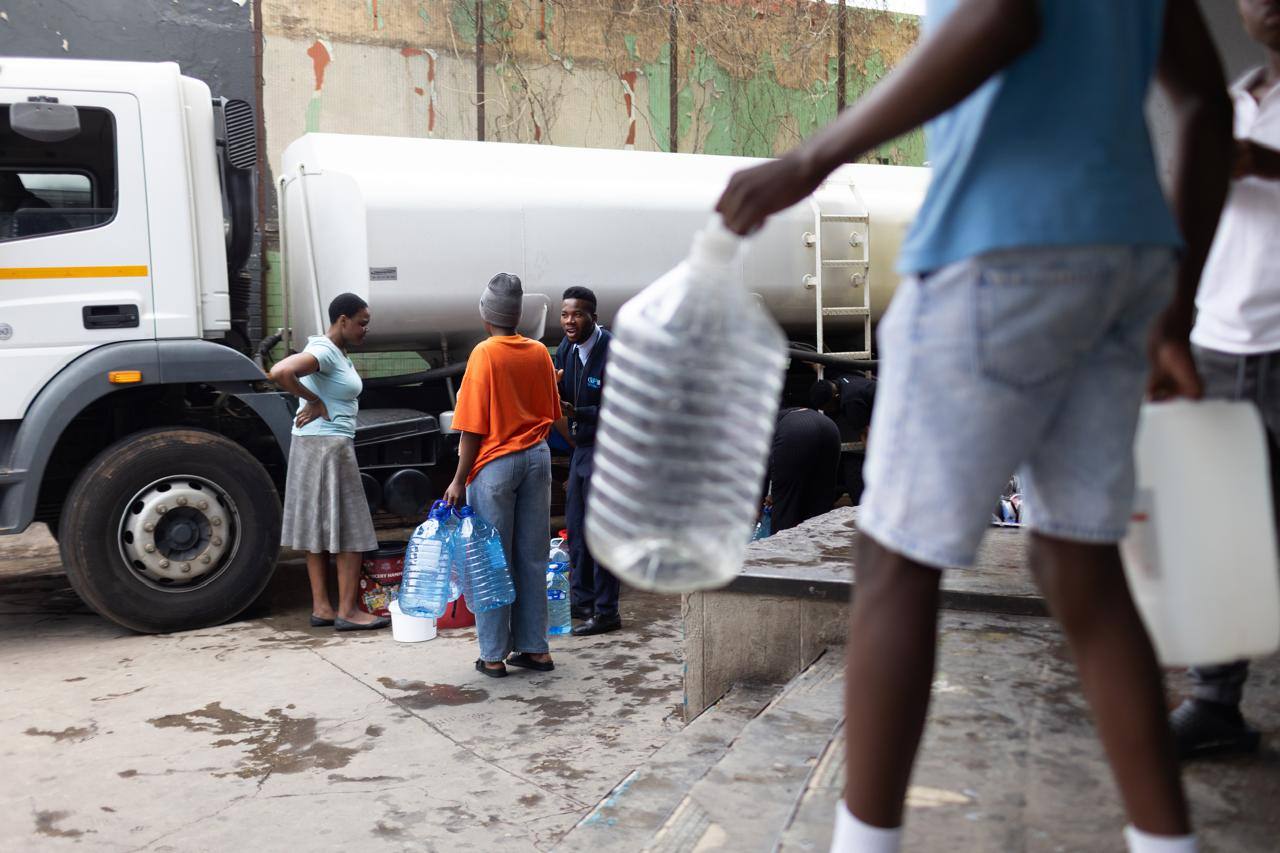 Residents collecting water from a tanker in South Africa