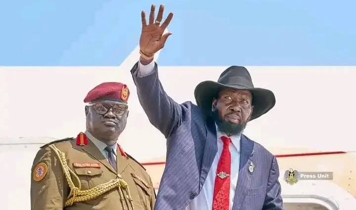 South Sudan President Salva Kiir Mayardit waving as he boards a plane at Juba International Airport to travel to Moscow