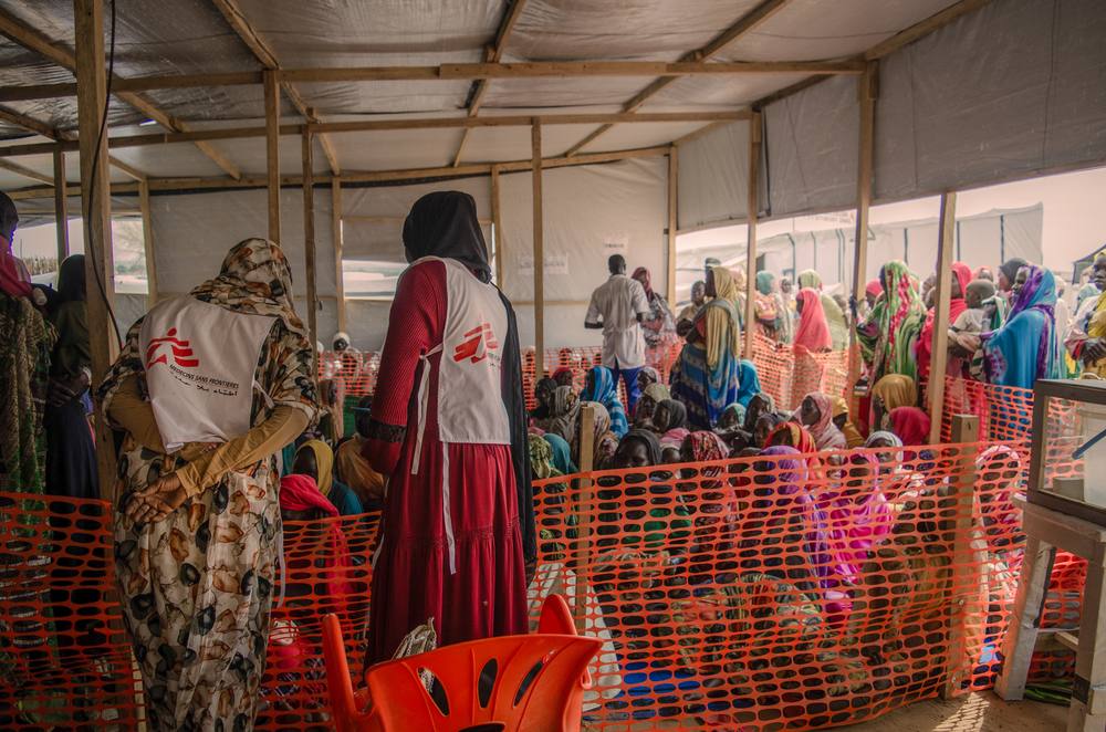 Sudanese refugees at a camp in Chad in a file photo — people who fled fighting in Sudan receiving aid near the border