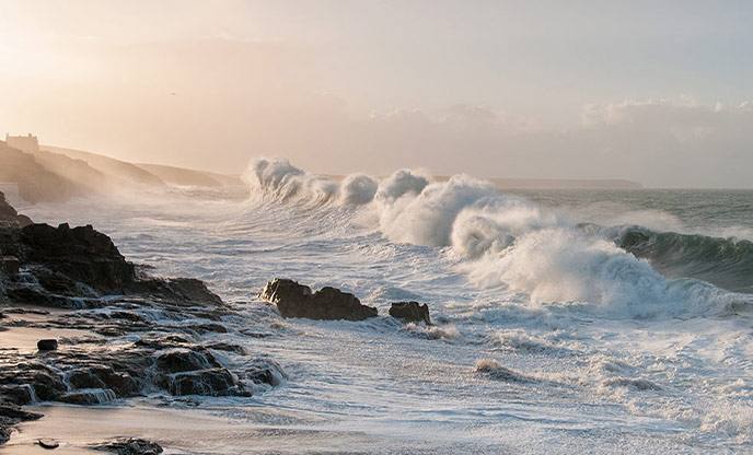 Storm waves crashing over rocks on the Cornish coast at Porthleven, England (file photo)