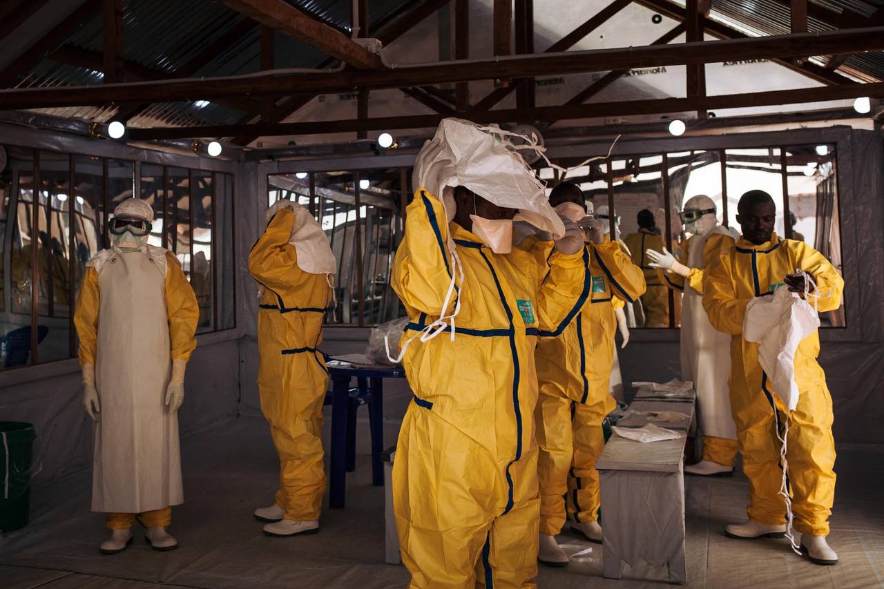 File photo: health workers in protective gear at an Ebola treatment centre in Africa