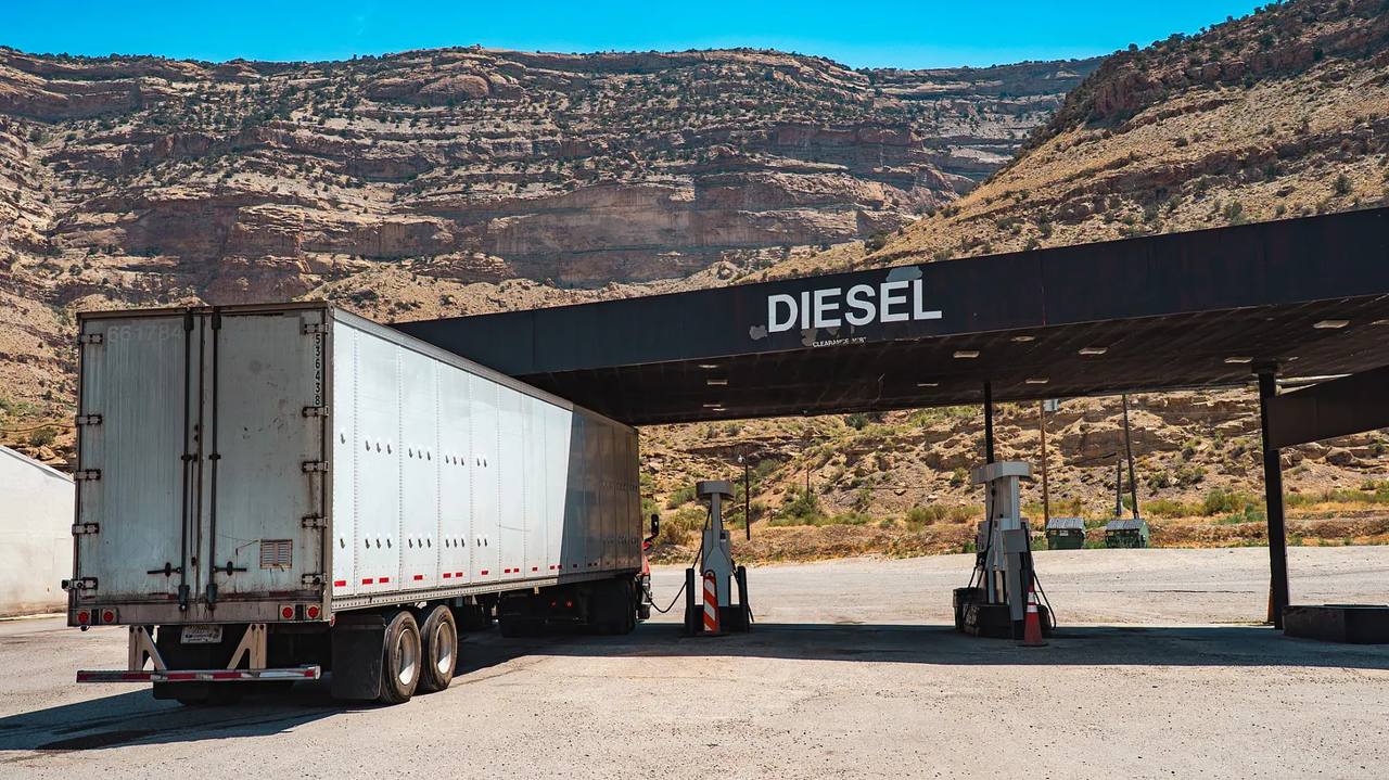 A semi truck at a diesel fuel pump at a US truck stop