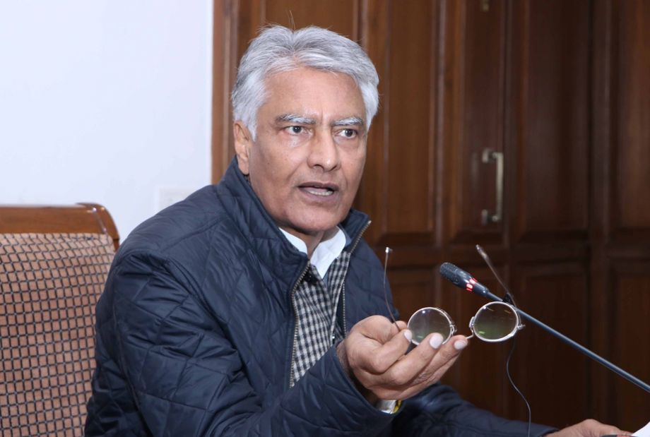 Former Punjab BJP president Sunil Jakhar speaking at a press conference, holding his glasses