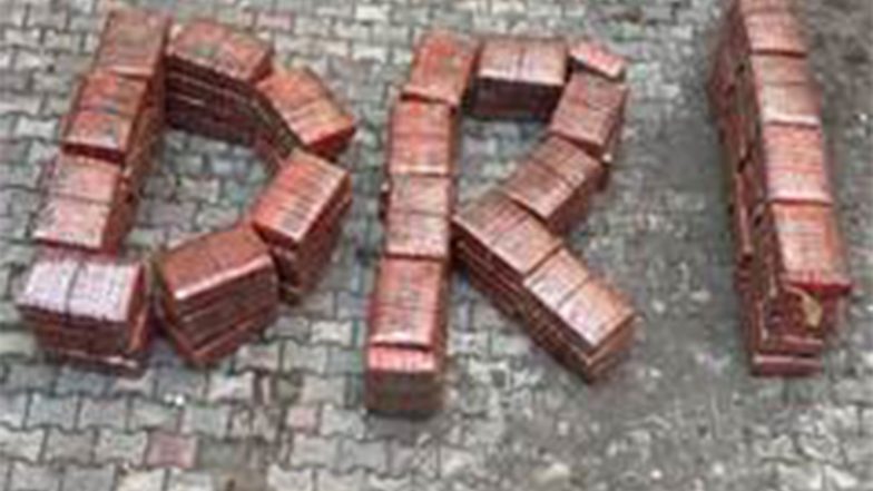 Seized ganja packets arranged on paving to spell 'DRI' after the Gorakhpur–Kushinagar interception
