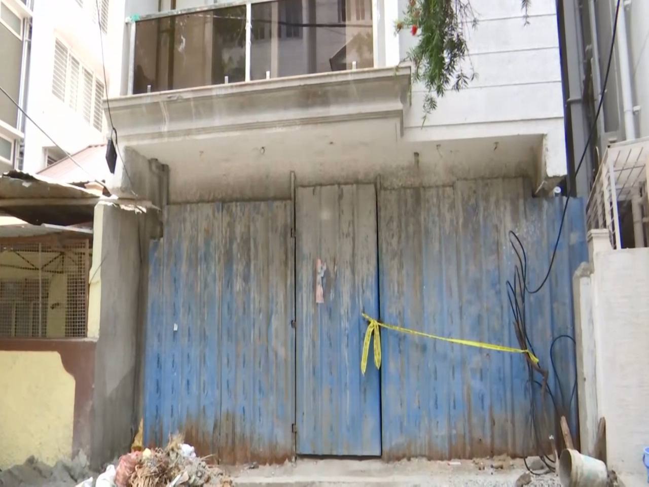 The under-construction house in Pulikeshi Nagar, Bengaluru, sealed with yellow police tape after a suspected blast injured two people