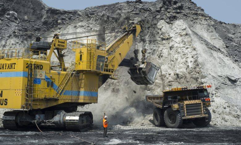A Coal India open-cast coal mine with heavy machinery in India