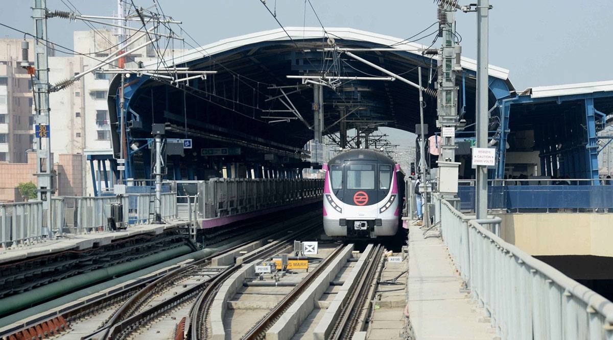 A Delhi Metro train arriving at an elevated station in New Delhi