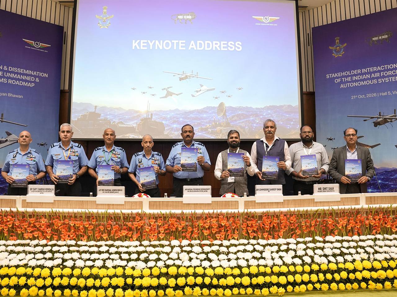 IAF and Drone Federation India officials holding the Unmanned and Autonomous Systems Roadmap at Vigyan Bhawan, New Delhi