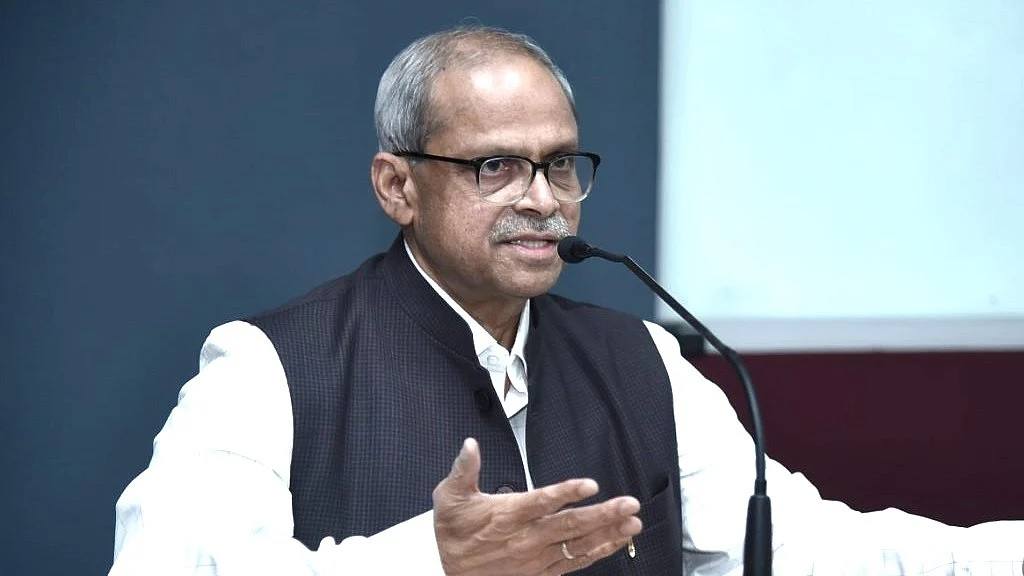 Economist Parakala Prabhakar speaking at a microphone at a public event