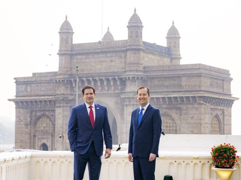 US Secretary of State Marco Rubio and US Ambassador to India Sergio Gor standing in front of the Gateway of India in Mumbai
