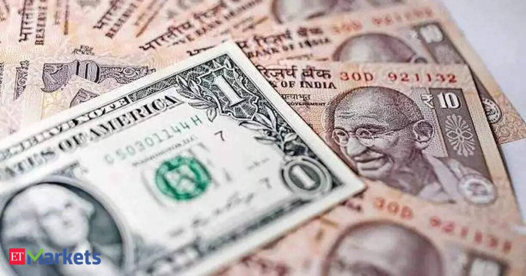 Indian rupee notes and US dollar bills — file photo of currency trade