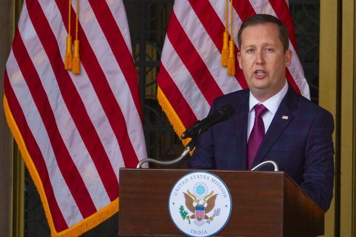 US Ambassador to India Sergio Gor speaking at a US Mission India podium in front of American flags