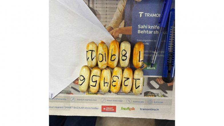 The 11 cocaine capsules recovered by DRI officers at Mumbai airport, laid out and numbered on a newspaper