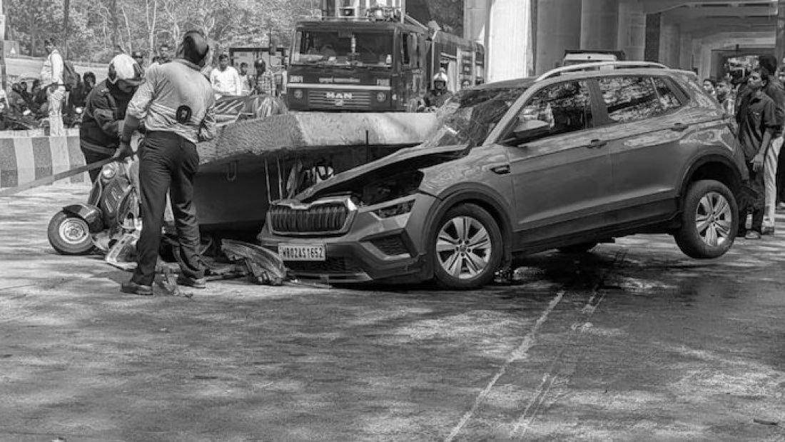 File photo of the February 14, 2026 Mulund metro slab collapse scene in Mumbai, with a crushed car under the fallen slab and a fire tender behind