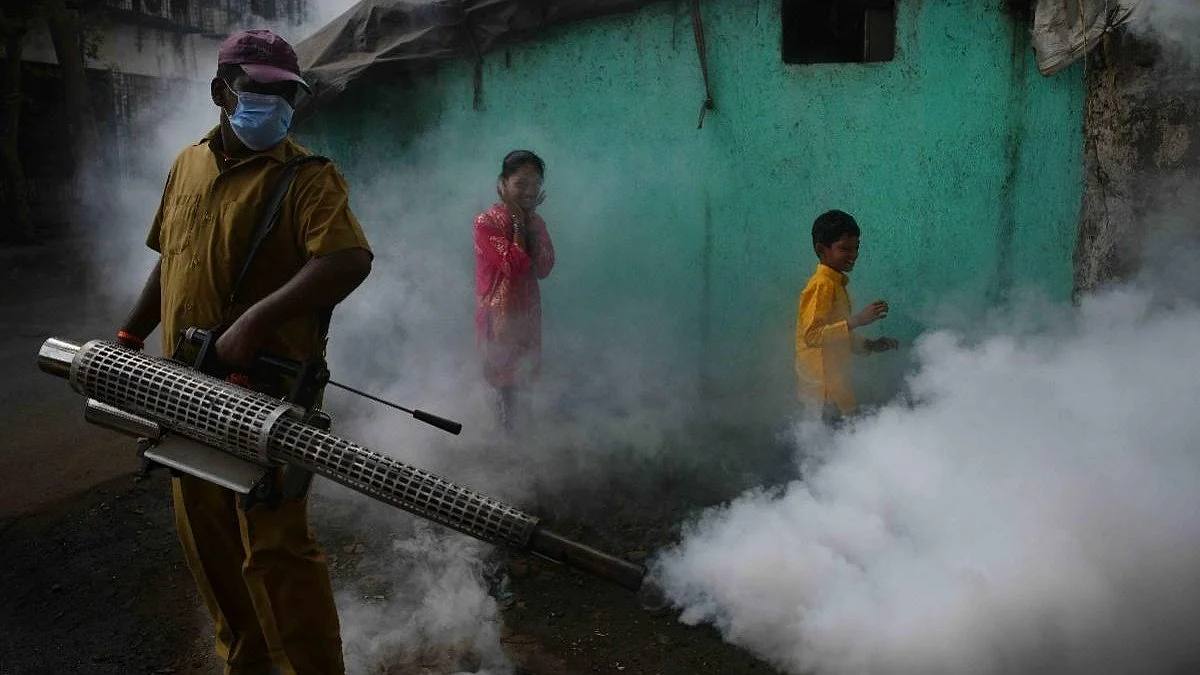 File photo of a municipal worker carrying out fogging to control mosquitoes in Pune