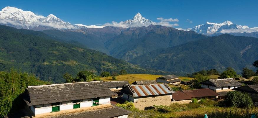 Dhampus village in Kaski district, Nepal, with terraced hills and Himalayan peaks in the background