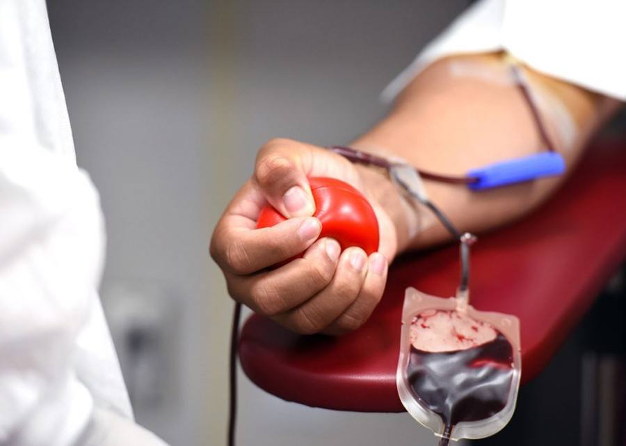 A donor giving blood at a blood transfusion service in Nepal