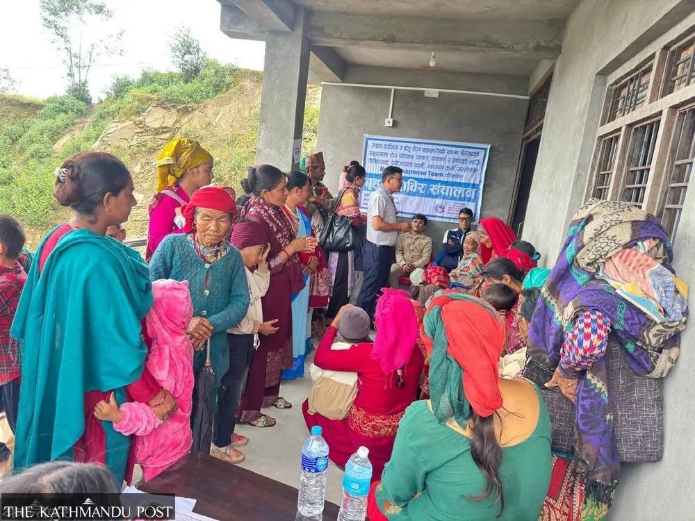 Residents gather at a health camp in Salyan district, Nepal, during the scrub typhus outbreak response