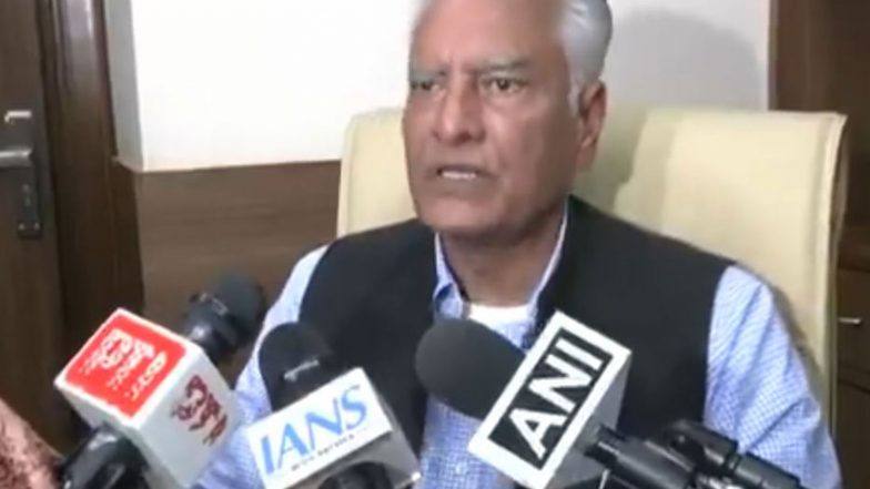 Sunil Jakhar speaking to reporters with ANI and IANS microphones in front of him