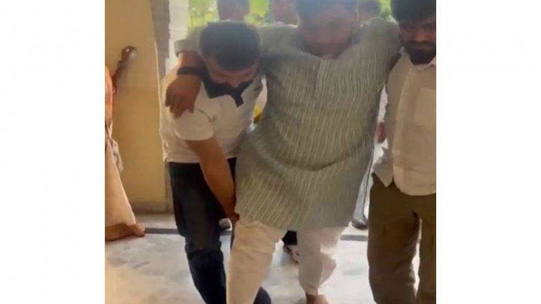 Rajasthan Congress president Govind Singh Dotasra being helped to walk after injuring his leg during the sit-in at the Jaipur Police Commissionerate