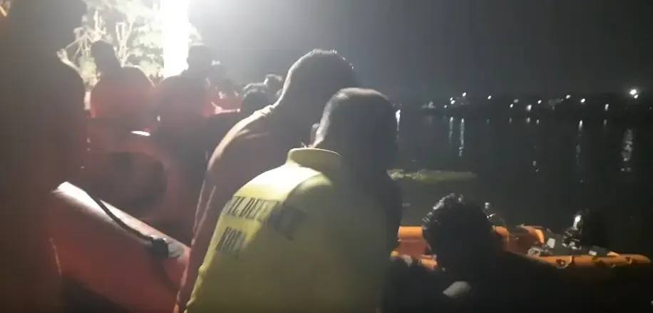 Rescue personnel with inflatable boats during the night search in the Kotri canal in Kota