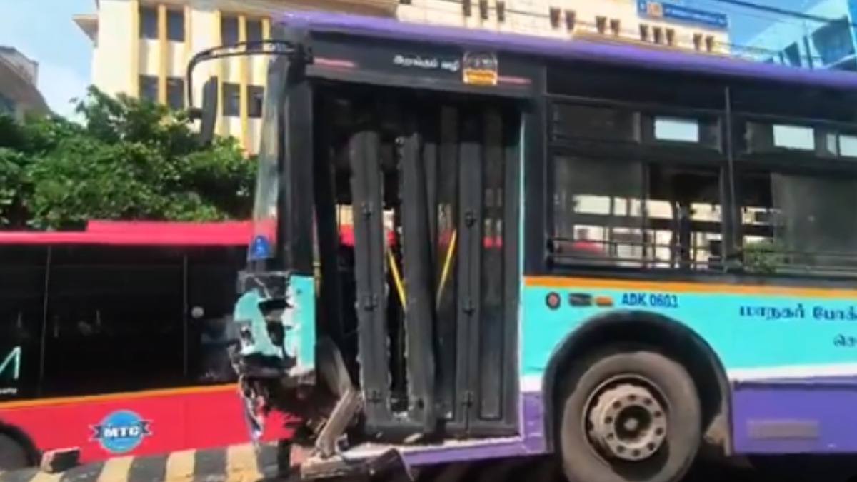 A damaged MTC bus with a crushed front mounted on a road divider outside the Madras High Court in Chennai