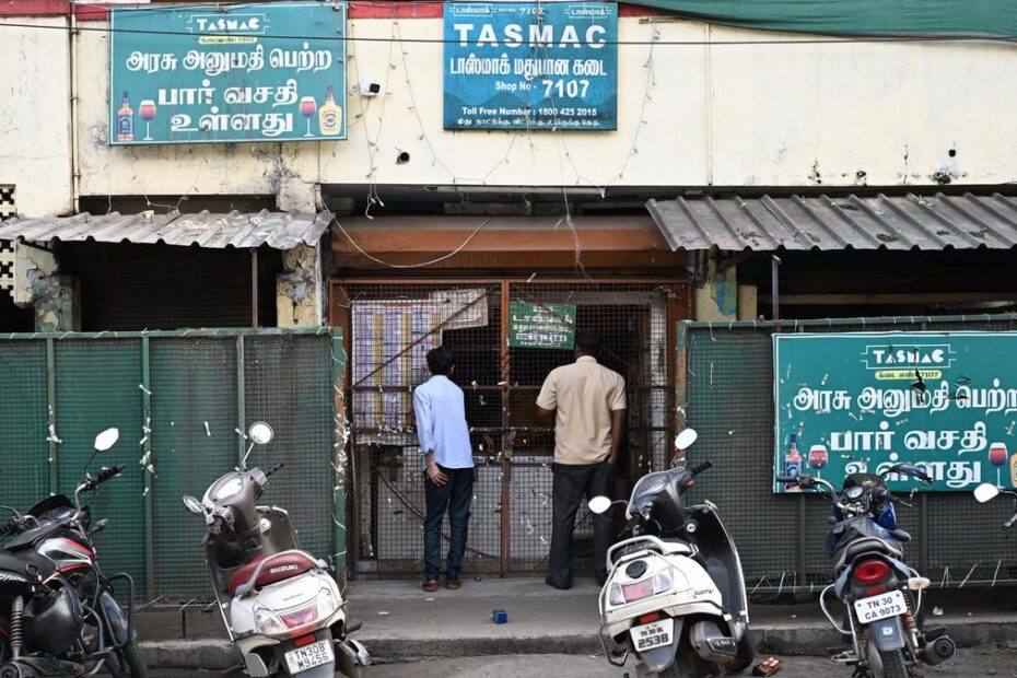 Customers outside a TASMAC retail liquor outlet in Tamil Nadu