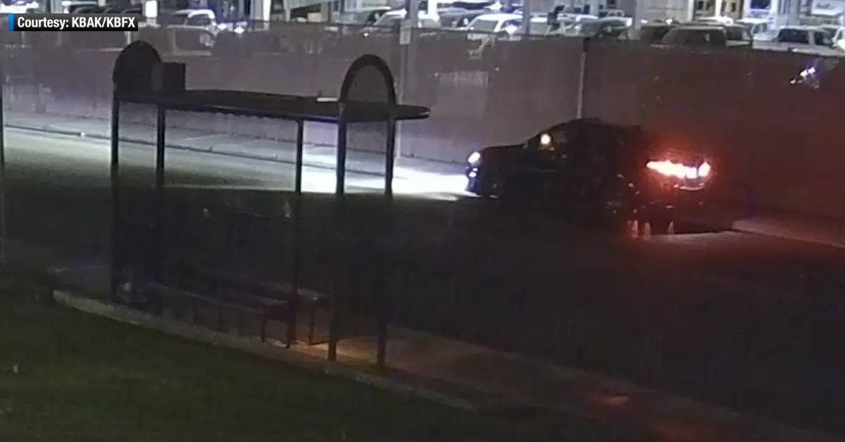 Surveillance still showing a dark vehicle outside the KBAK/KBFX television studios in Bakersfield at night