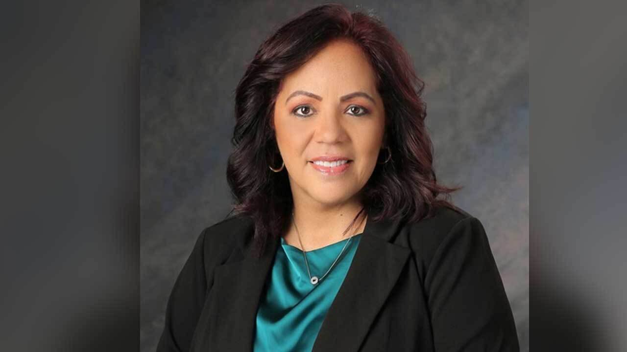 Portrait photograph of Kissimmee Mayor Jackie Espinosa in a black blazer and teal blouse