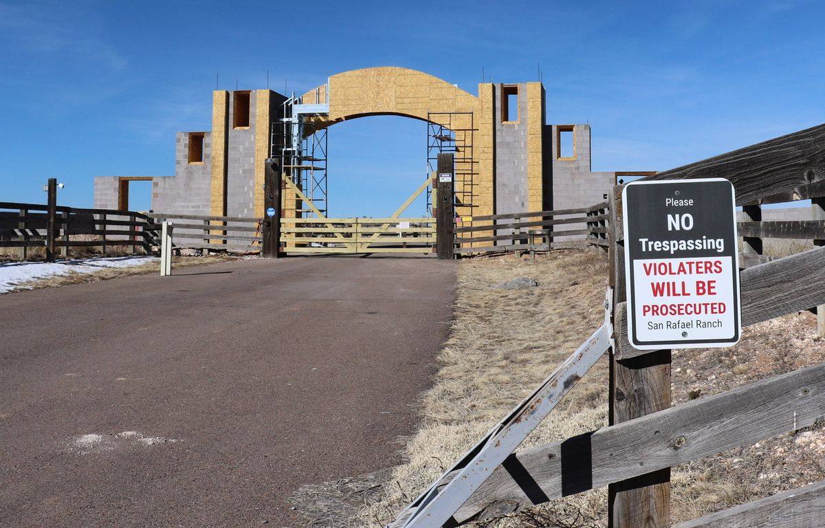 File photo of the gated entrance to the former Zorro Ranch (now San Rafael Ranch) near Stanley, New Mexico, with a no-trespassing sign