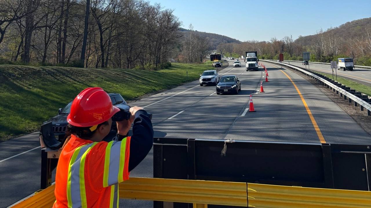 File photo of a highway maintenance worker beside a road in New York state